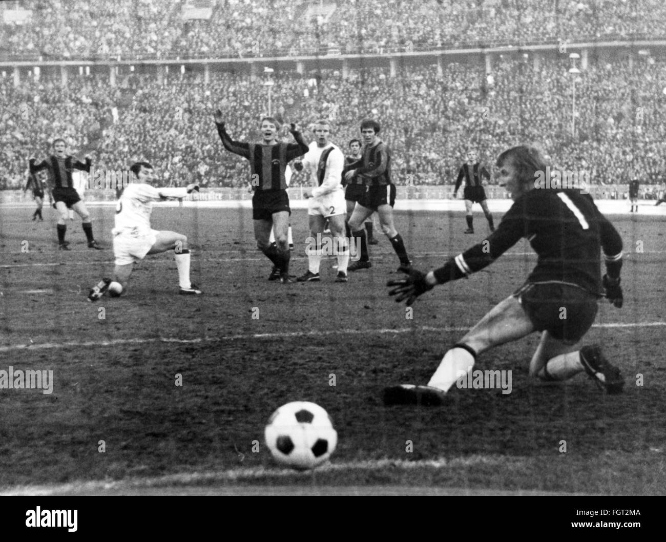 sports,football,games Germany,national league,season 1970 / 1971,14th match day,game Hertha BSC versus Borussia Moenchengladbach(4:2),Olympic stadium,Berlin,7.11.1970,first goal for Herta by Weber,by left: Juergen Weber,Ludwig Mueller,Zoltan Varga,Berti Vogts,Lorenz Horr,Wolfgang Kleff,1:0,nets,goal keeper,goalkeeper,netminder,goalie,goal keepers,goalkeepers,netminders,goalies,keep goal,unsuccessful save,goal net,football match,soccer match,football matches,footballer,footballers,kicker,football player,football players,act,Additional-Rights-Clearences-Not Available Stock Photo