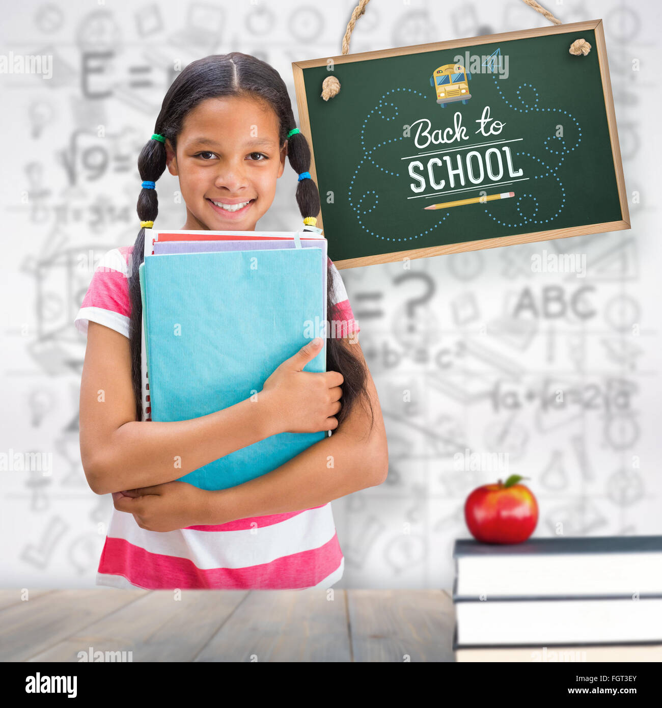 Composite image of cute pupil smiling at camera in library Stock Photo ...