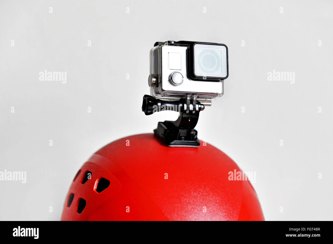 Detail shot with action camera mounted on a red sports helmet Stock Photo