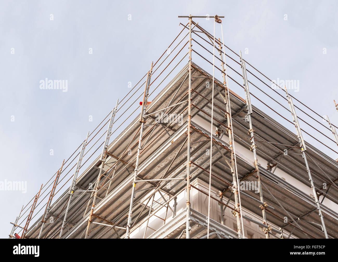 House for renovation with the scaffolding for bricklayers Stock Photo