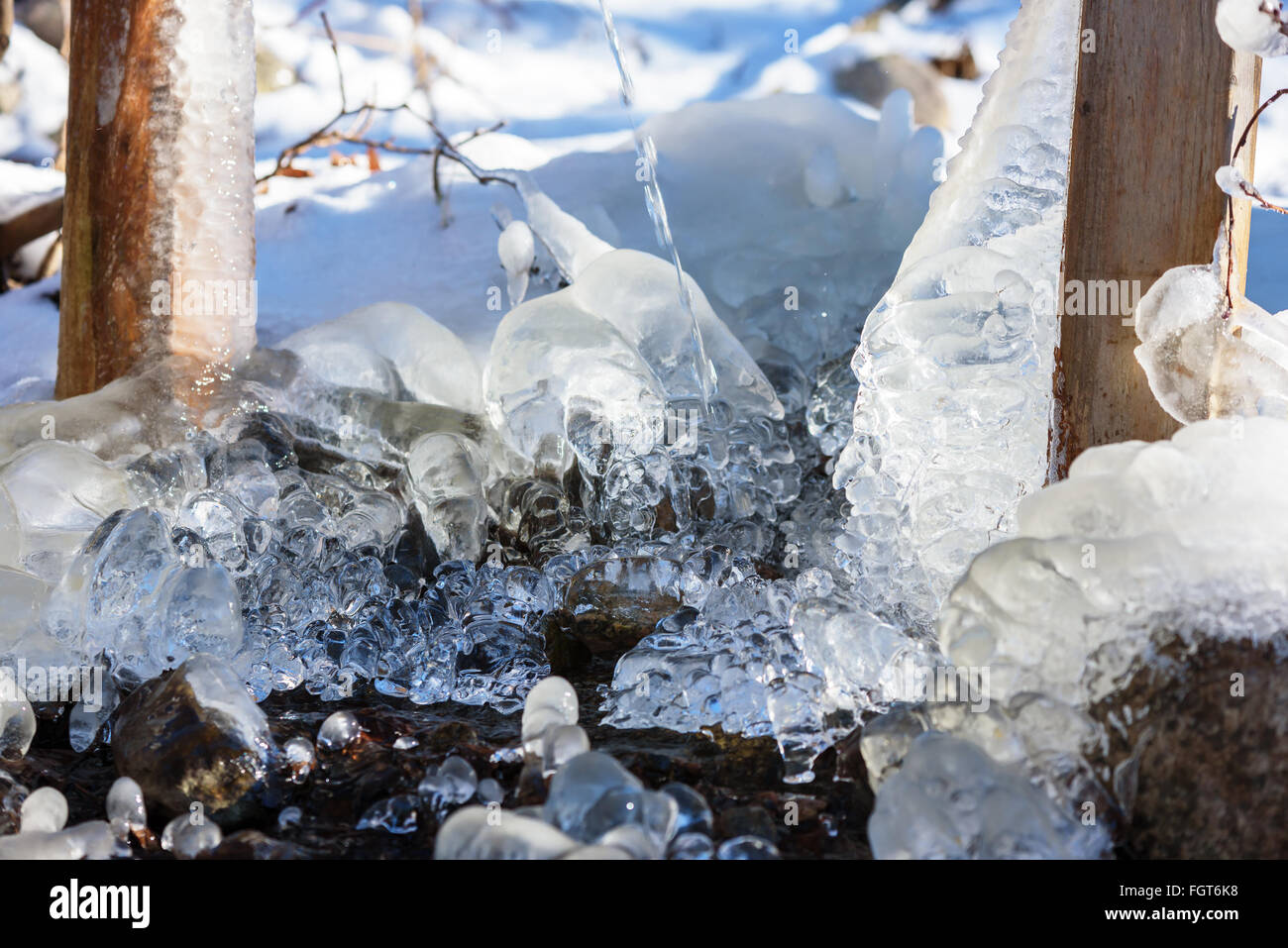 Abstract ice formation in warm weather when it starts to melt and get smooth on the surface. Stock Photo