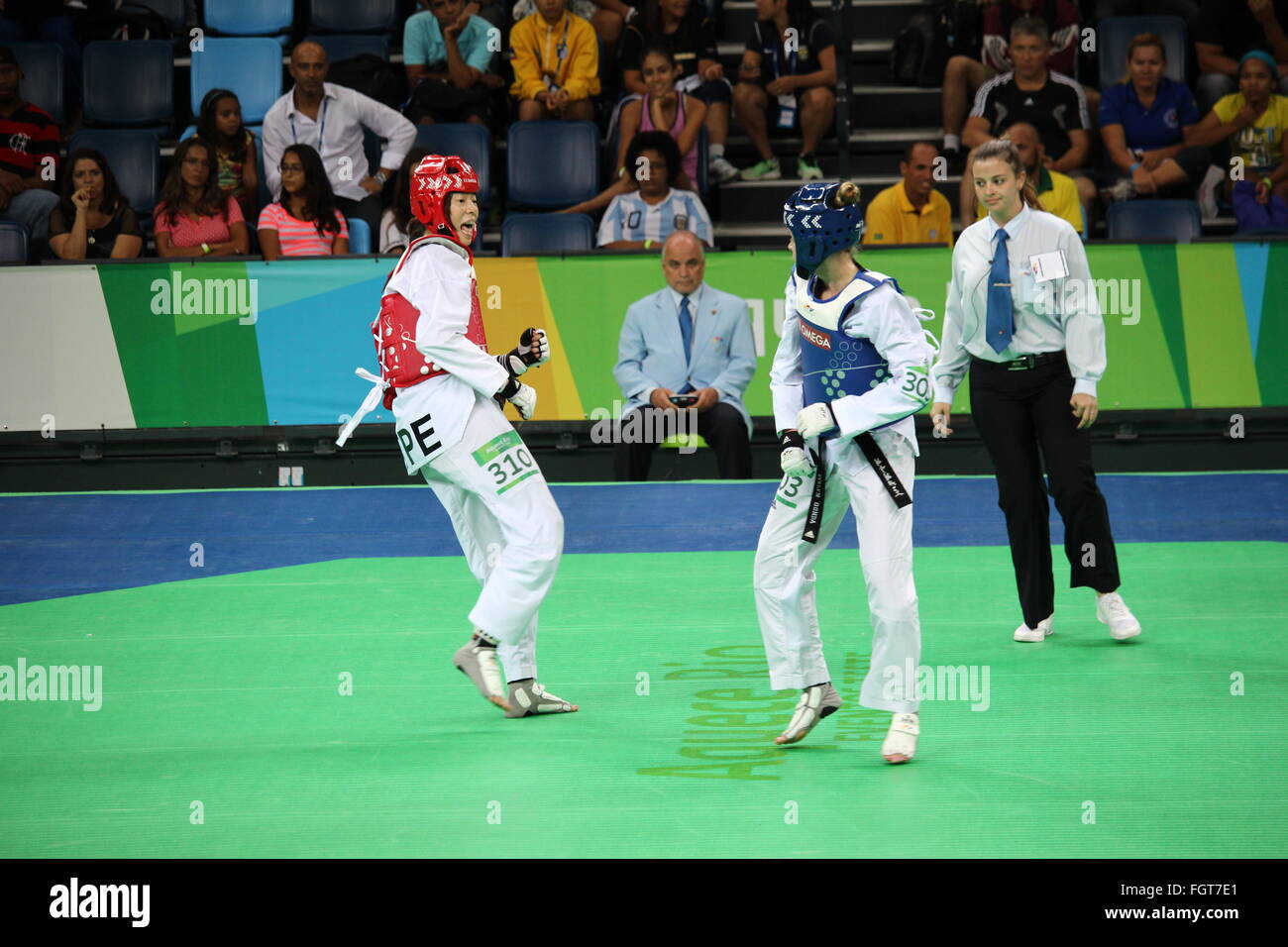 Rio de Janeiro, Brazil, 21 February 2016: Rio 2016 Olympic Park holds a test event for Rio 2016 Olympic Games. The International Taekwondo Tournament meets 64 athletes from 15 countries. Among the athletes participating in the competition are: Iris Tang Sing, Rafaela Ahmad, João Miguel Neto, Leonardo de Moraes and Andre Bilia, from Brazil, Rui Bragança from Portugal anda Mayu Yama from Japan. In this photo are the Evelyn Gonda from Canada and Chuang Chen Yu from Chinese Taipei Credit:  Luiz Souza/Alamy Live News Stock Photo