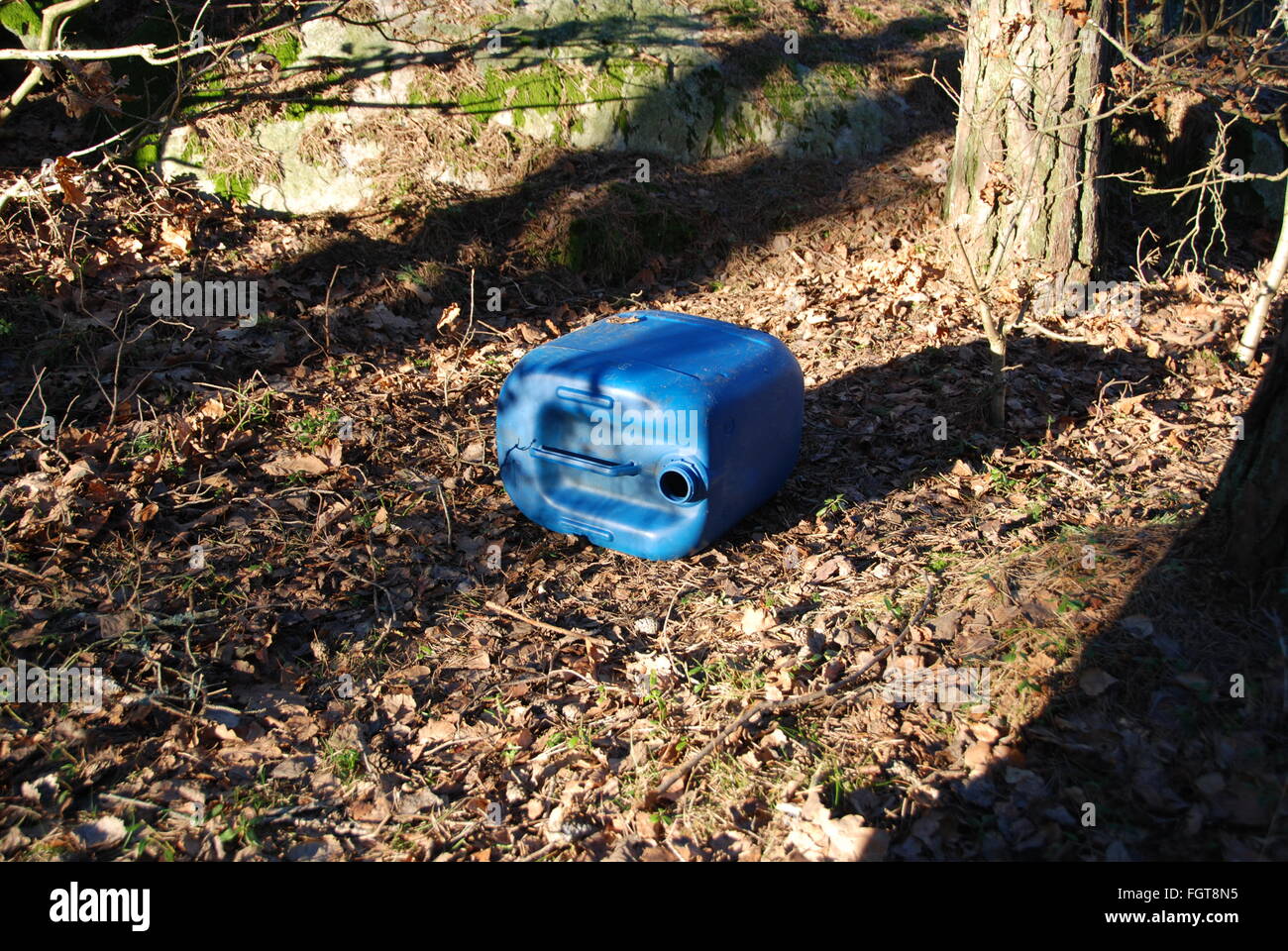 Littering nature and pollution of the environment with a plastic can Stock Photo