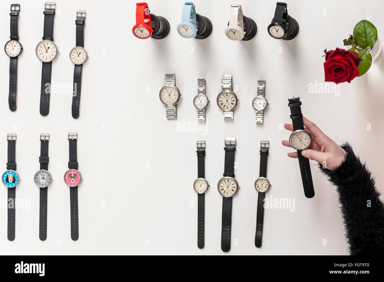 London, UK.  22 February 2016. A woman examines items by Newgate Watches, as Scoop London takes place at the Saatchi Gallery in Chelsea.  Running concurrently with London Fashion Week AW16, the show attracts fashion buyers from around the world who come to meet designers presenting their products amongst the gallery's artworks. Credit:  Stephen Chung / Alamy Live News Stock Photo
