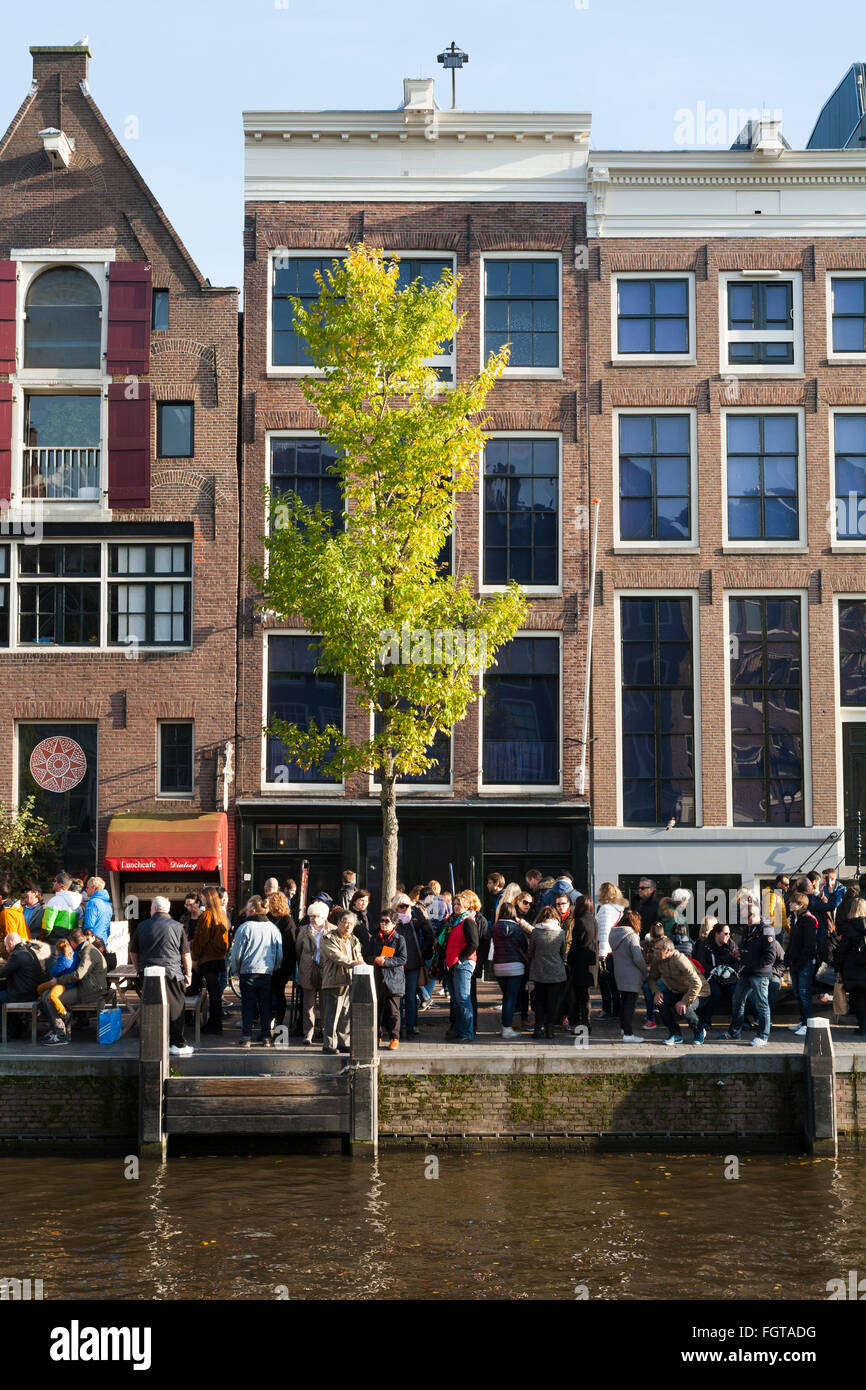 Tourist / tourists / visitors in front of Anne Frank 's House / museum in Amsterdam, Holland. The Netherlands. Stock Photo