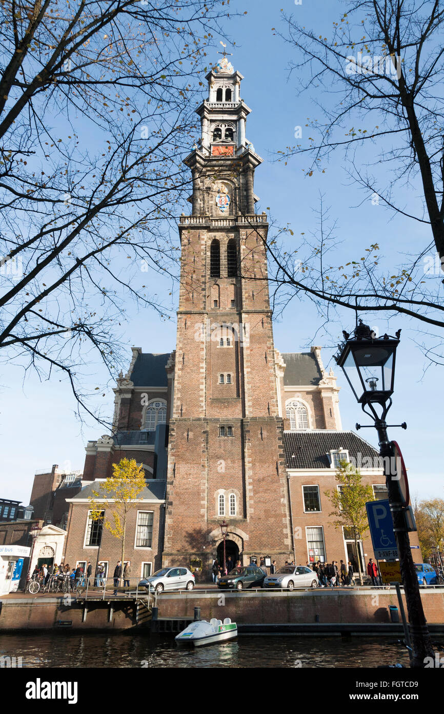Westerkerk is a Reformed church within Dutch Protestant church. Canal - side / west  side in Amsterdam, the Netherlands. Stock Photo