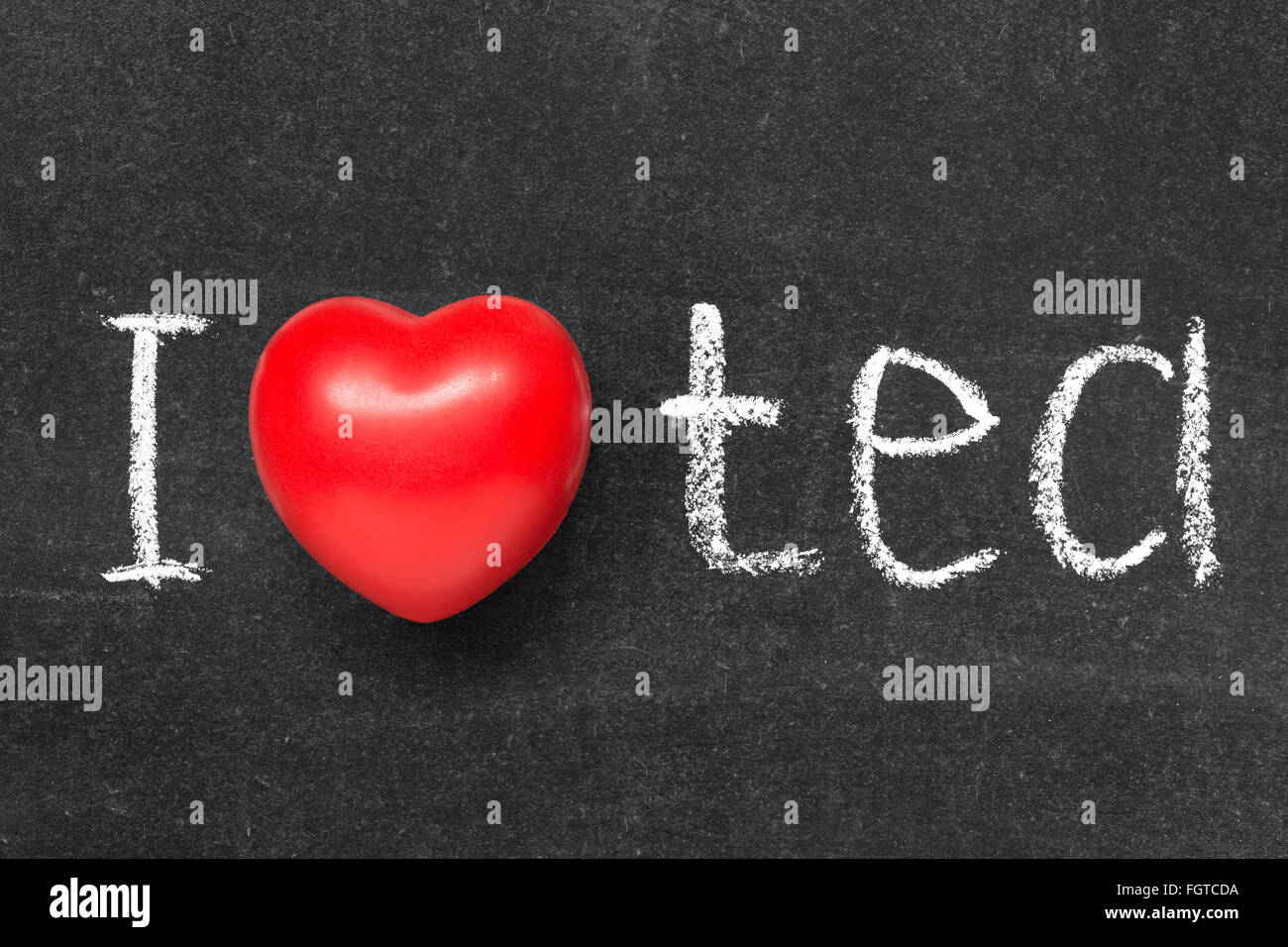 I love tea phrase phrase handwritten on blackboard with heart symbol instead of O Stock Photo