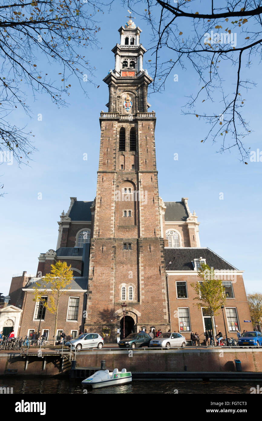 Westerkerk is a Reformed church within Dutch Protestant church. Canal - side / west  side in Amsterdam, the Netherlands. Stock Photo