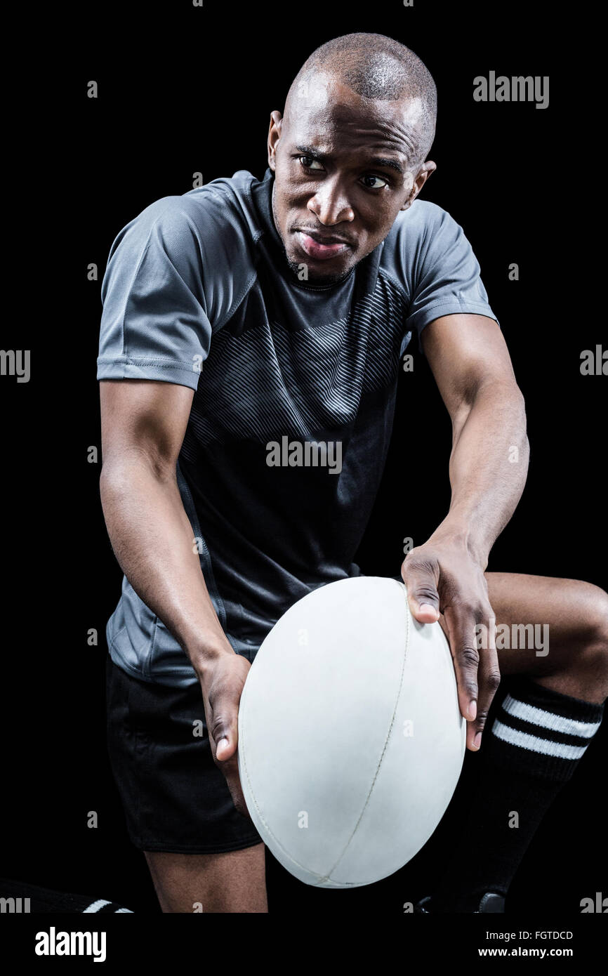 Determined rugby player with ball Stock Photo - Alamy