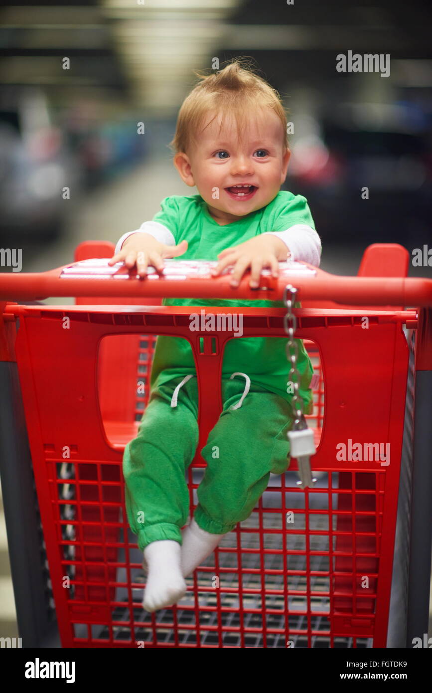 baby in shopping cart Stock Photo Alamy