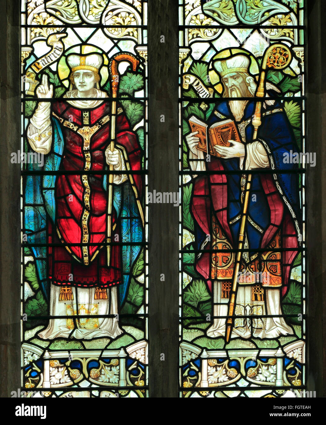 St. Patrick and  St. David, stained glass window by J. Powell & son, 1900,  Blakeney, Norfolk England UK Saints saint Stock Photo