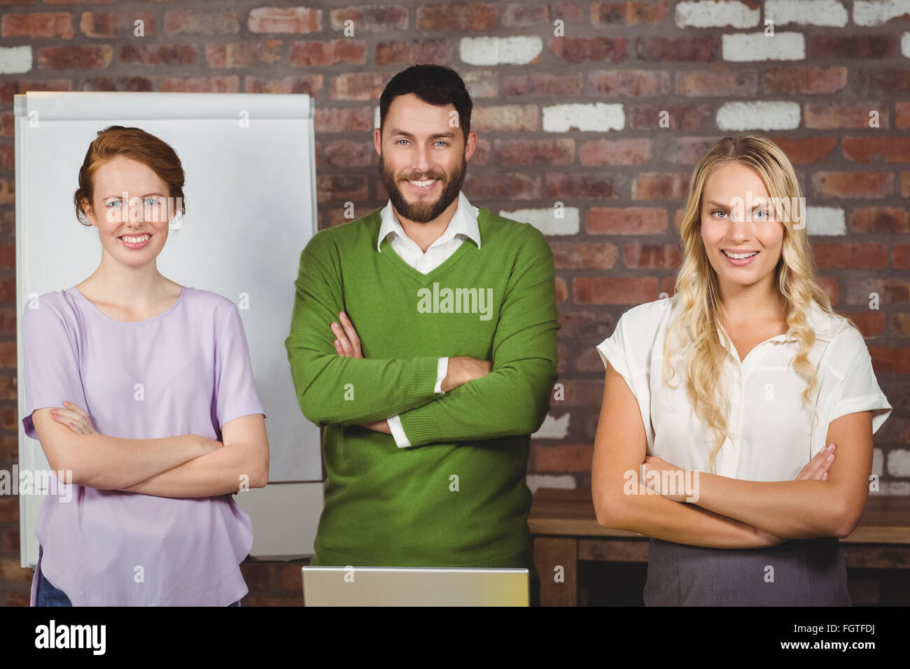 Portrait of happy business colleagues with arms crossed Stock Photo - Alamy