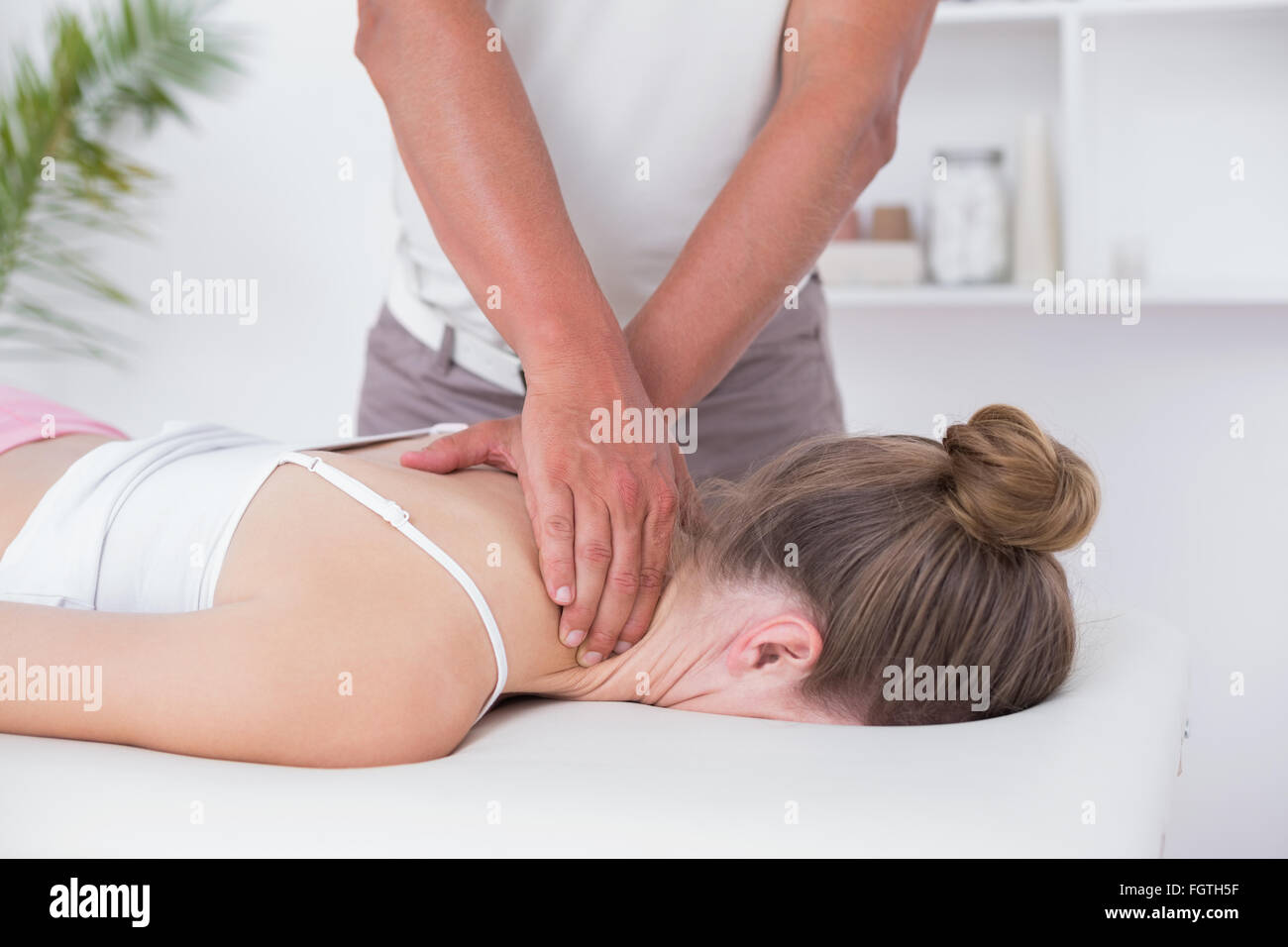 https://c8.alamy.com/comp/FGTH5F/physiotherapist-doing-neck-massage-to-his-patient-FGTH5F.jpg