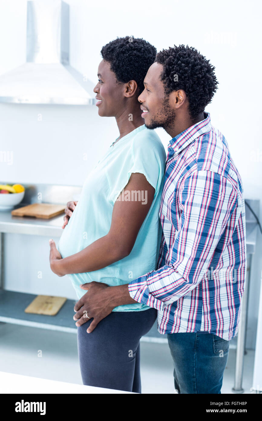 Man embracing his happy pregnant wife Stock Photo - Alamy