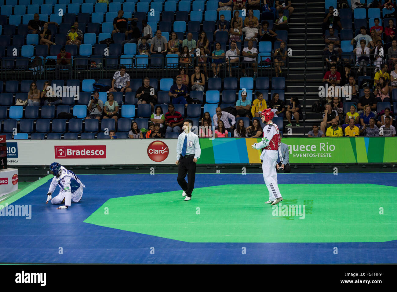 Rio de Janeiro, Brazil, 21 February 2016: Rio 2016 Olympic Park holds a test event for Rio 2016 Olympic Games. The International Taekwondo Tournament meets 64 athletes from 15 countries. Among the athletes participating in the competition are: Iris Tang Sing, Rafaela Ahmad, João Miguel Neto, Leonardo de Moraes and Andre Bilia, from Brazil, Rui Bragança from Portugal anda Mayu Yama from Japan. In this photo are the American Healy J. and the Tunisian Trabelsi Y. during the fight which ended with the American victory. Credit:  Luiz Souza/Alamy Live News Stock Photo