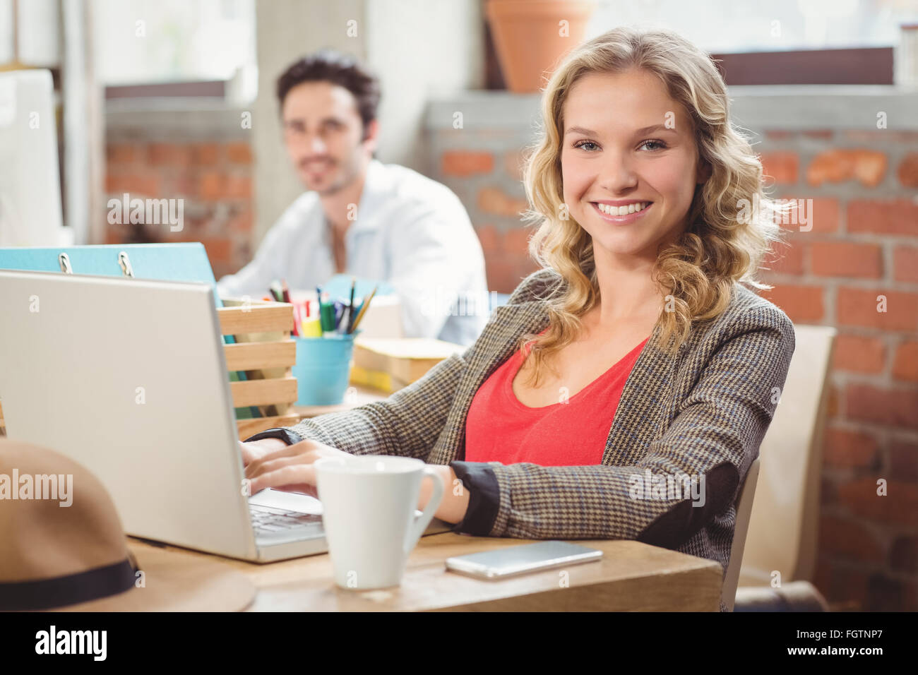 Portrait of beautiful young businesswoman in office Stock Photo - Alamy