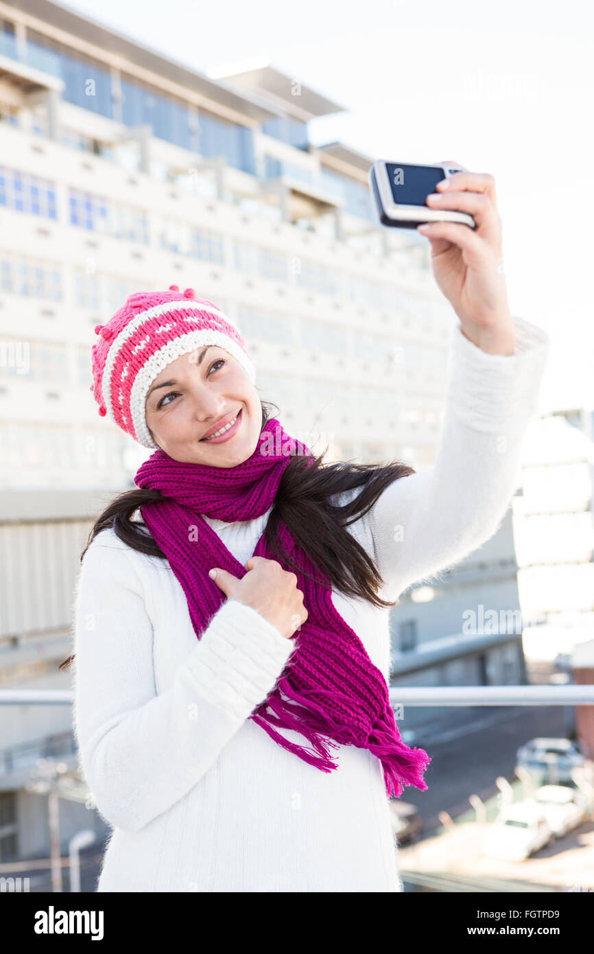 Happy woman taking a selfie Stock Photo - Alamy
