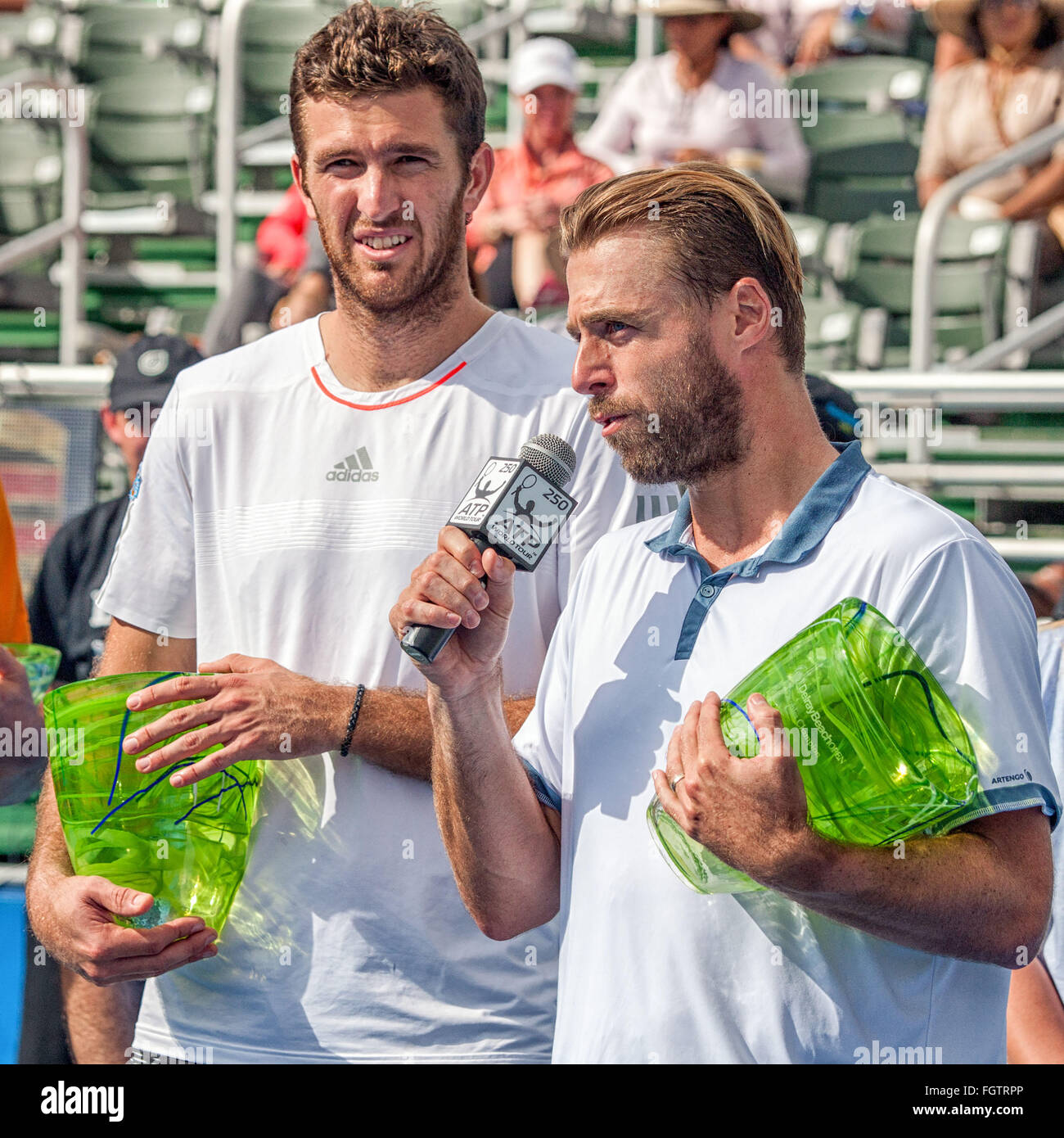 Delray Beach, Florida, US. 21st Feb, 2016. Holding their trophies, Frenchman FABRICE MARTIN speaks as his doubles partner Austrian OLIVER MARACH listens. They staged a dramatic comeback to beat the BRYAN BROTHERS in the doubles final, 3-6, 7-6(7) 13-11, at the ATP World Tour Delray Beach Open in Delray Beach, Florida © Arnold Drapkin/ZUMA Wire/Alamy Live News Stock Photo