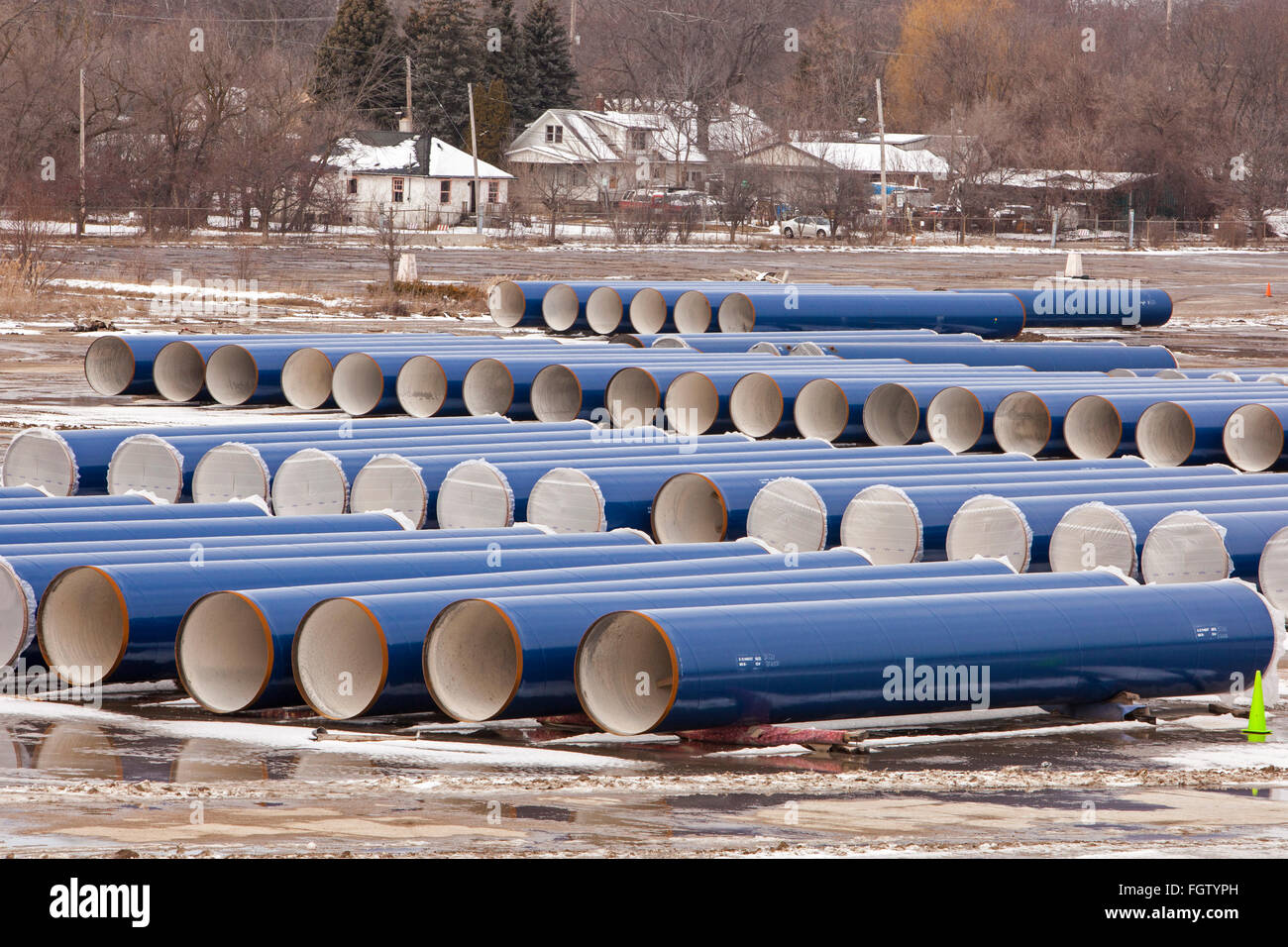 Flint, Michigan - Segments of pipe stored by the Karegnondi Water Authority for construction of a water pipeline for Flint. Stock Photo