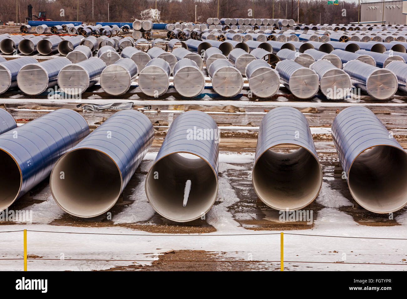 Flint, Michigan - Segments of pipe stored by the Karegnondi Water Authority for construction of a water pipeline for Flint. Stock Photo