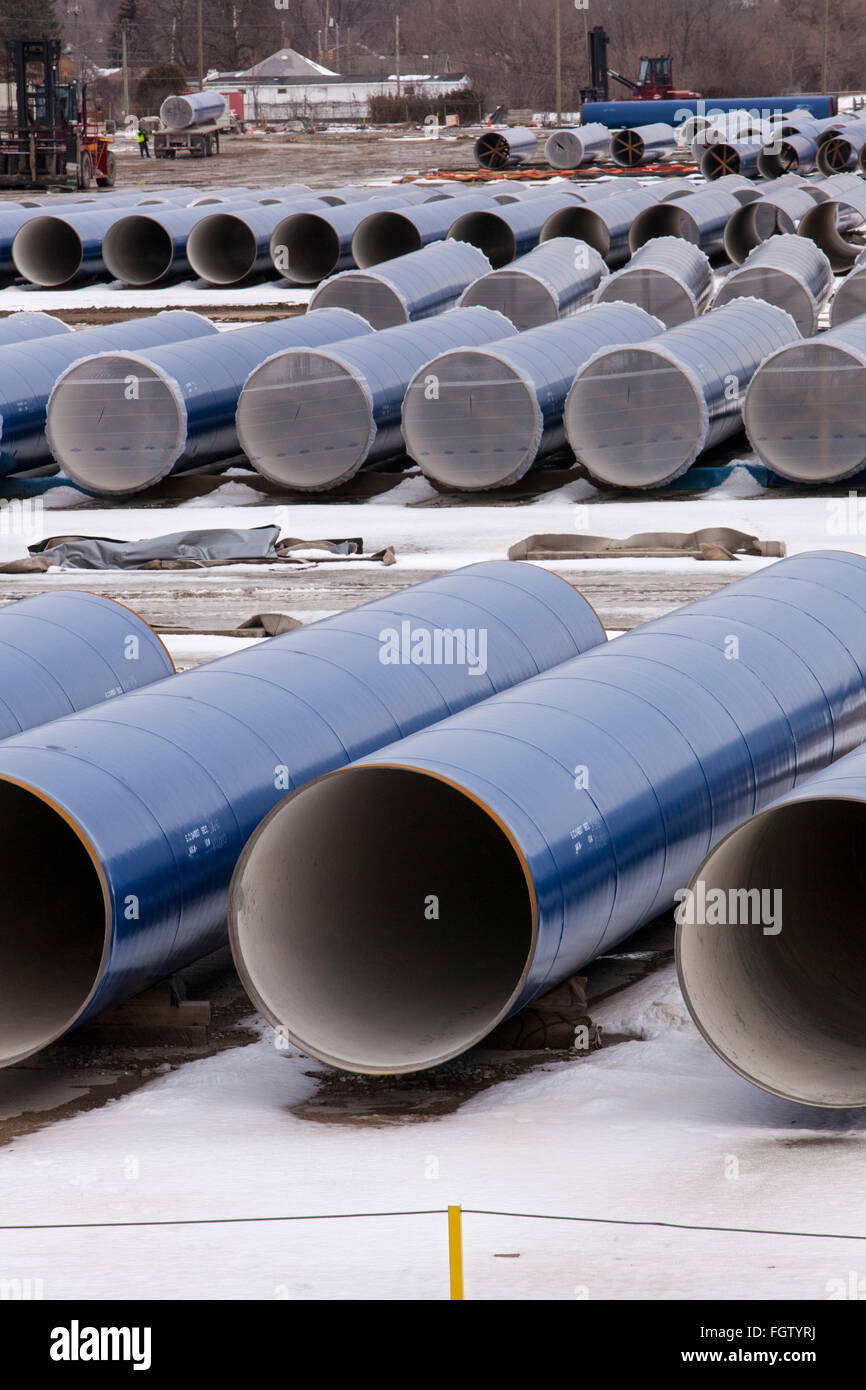 Flint, Michigan - Segments of pipe stored by the Karegnondi Water Authority for construction of a water pipeline for Flint. Stock Photo