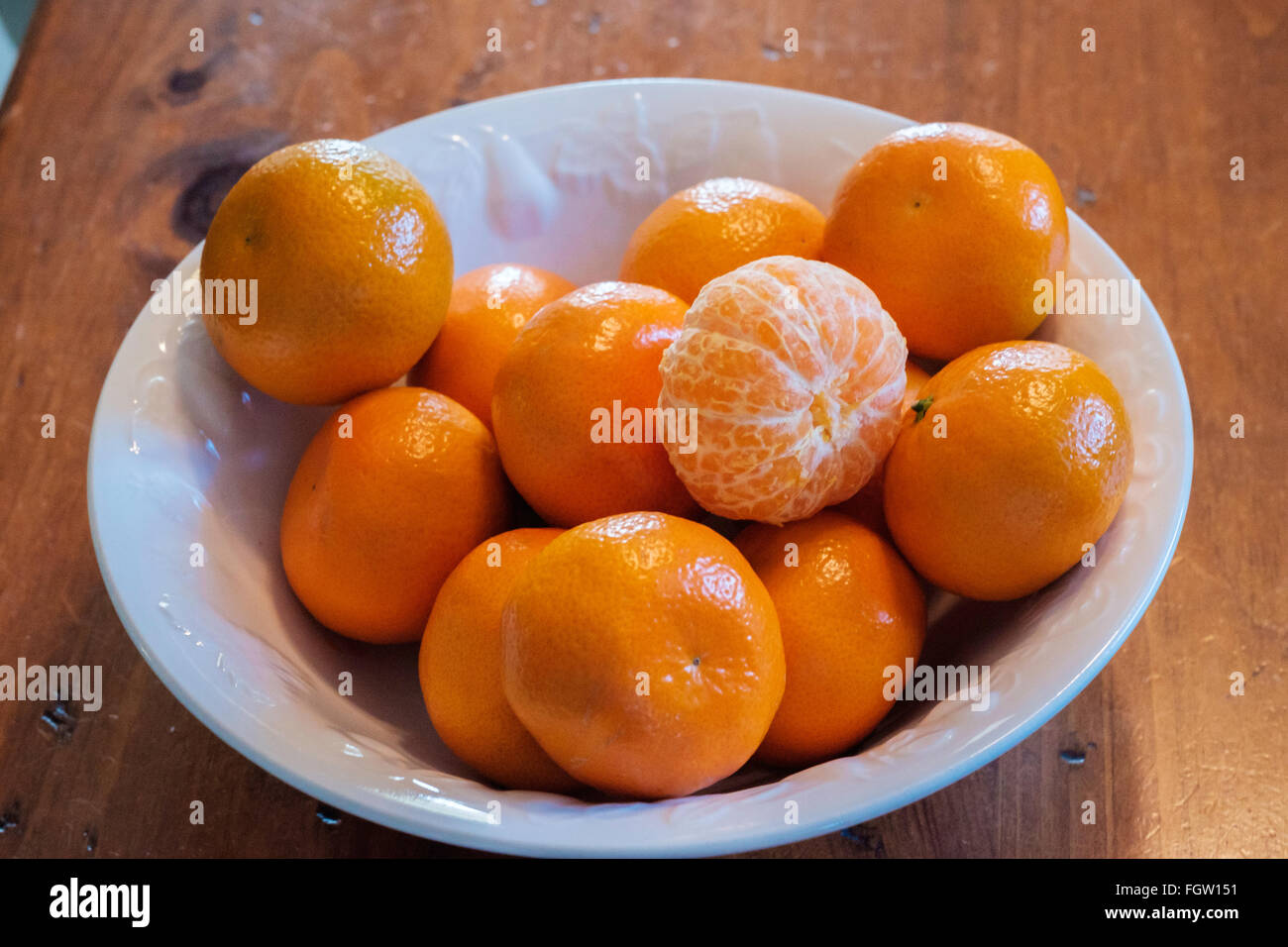 Mandarin oranges, Citrus reticulata, in a white bowl. Stock Photo