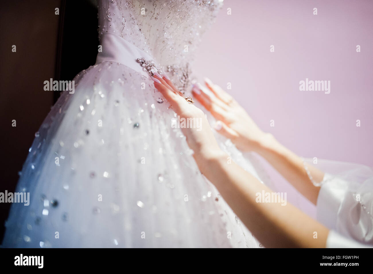 Hands of young beautiful bride at wedding dress Stock Photo - Alamy