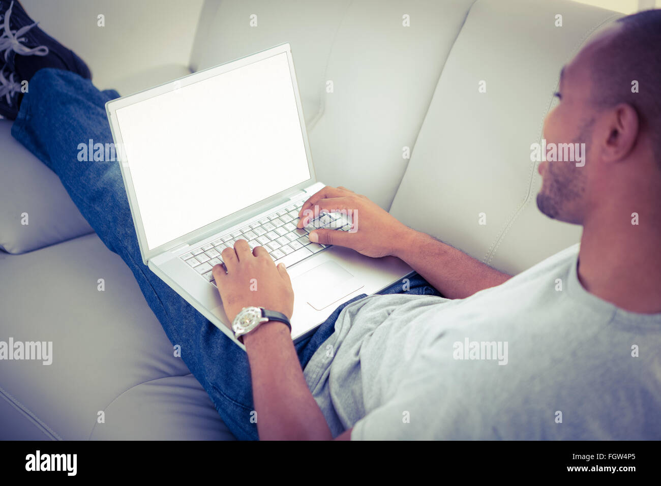 A man using his laptop Stock Photo - Alamy