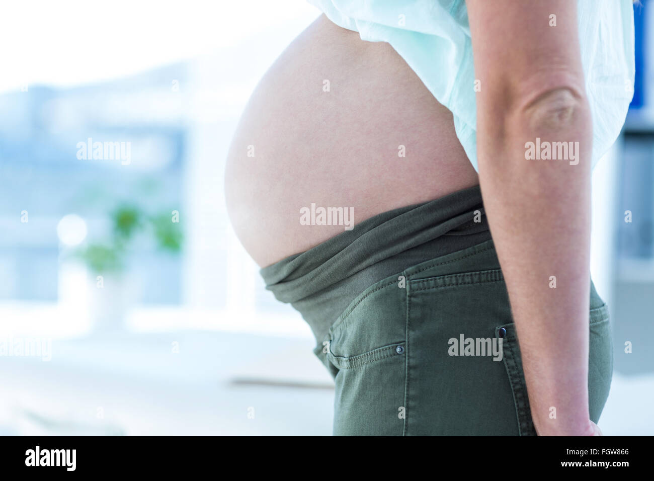 Midsection of pregnant woman Stock Photo