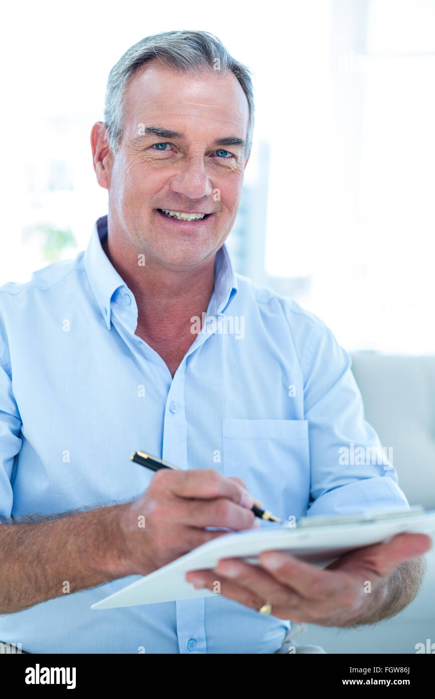Man notepad pen looking up hi-res stock photography and images - Alamy