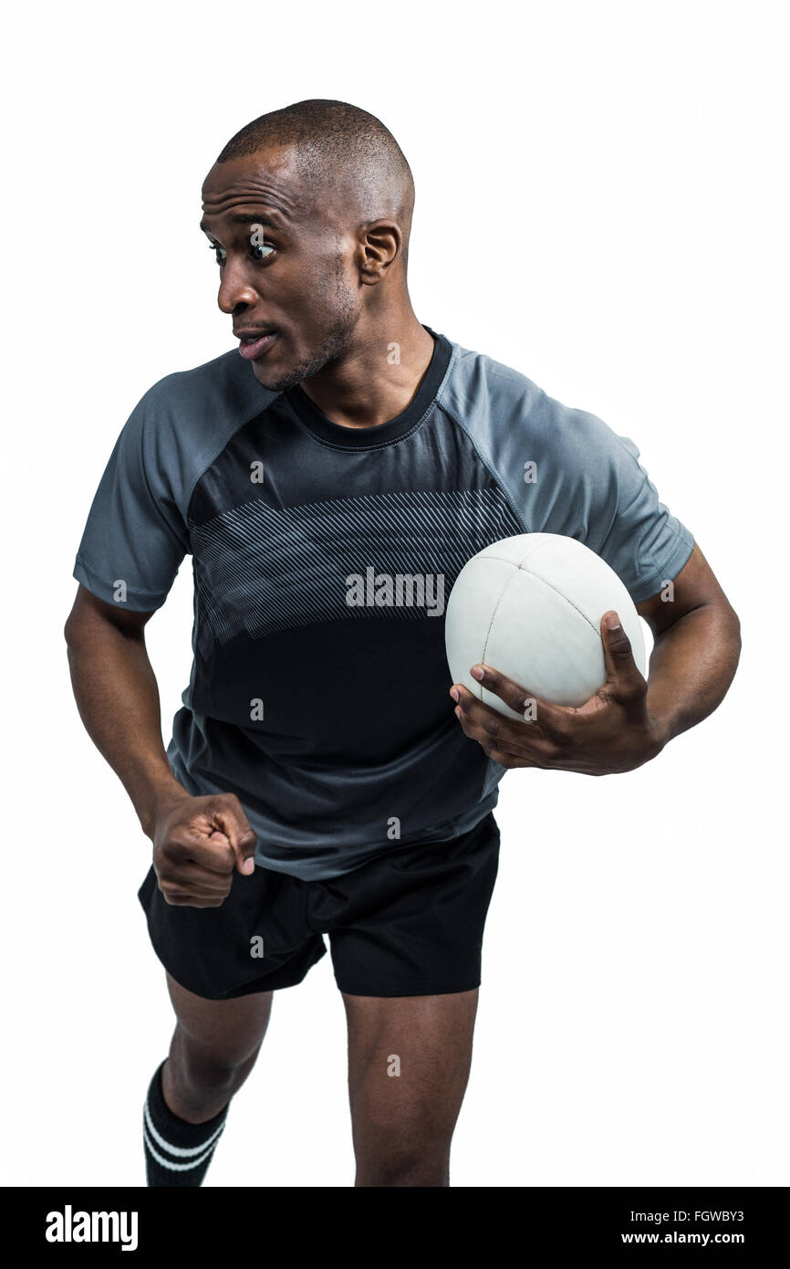 Sportsman running with clenched fist while holding rugby ball Stock Photo Alamy