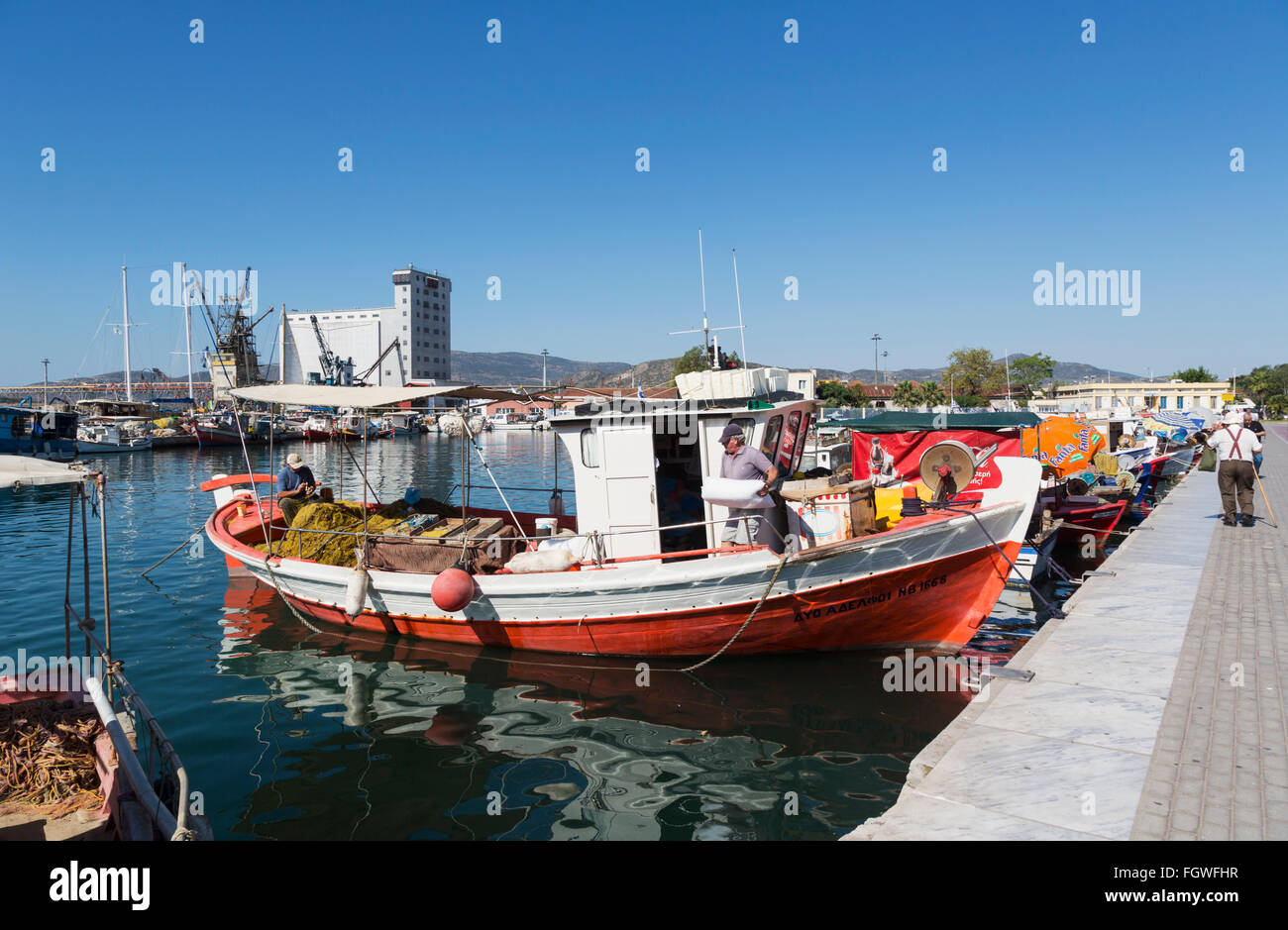 Volos, Thessaly, Greece.  Fishing boats moored on the harbour front. Stock Photo