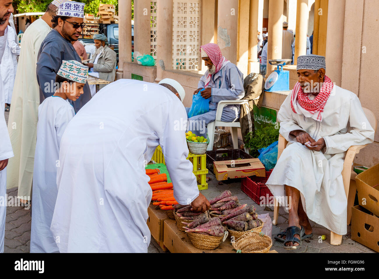 Omani Men Shopping In The Vegetable Market, Nizwa, Ad Dakhiliyah Region, Oman Stock Photo