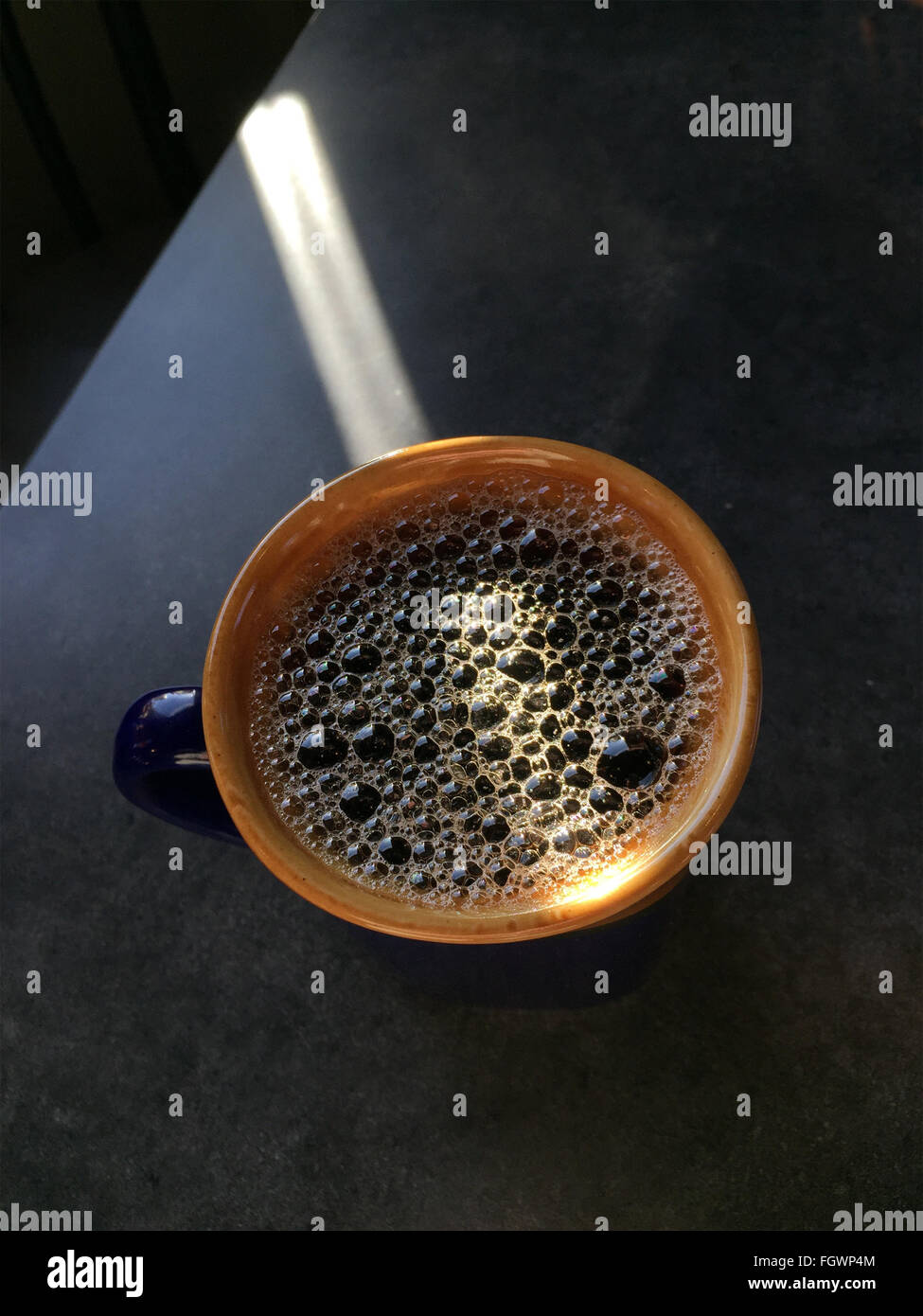 Foaming mug of coffee. Stock Photo