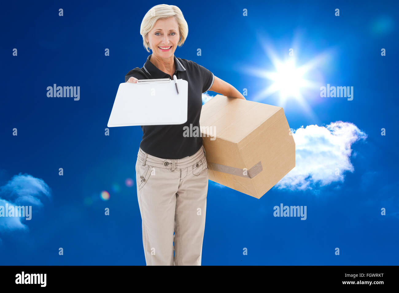 Composite image of happy delivery woman looking for signature Stock Photo