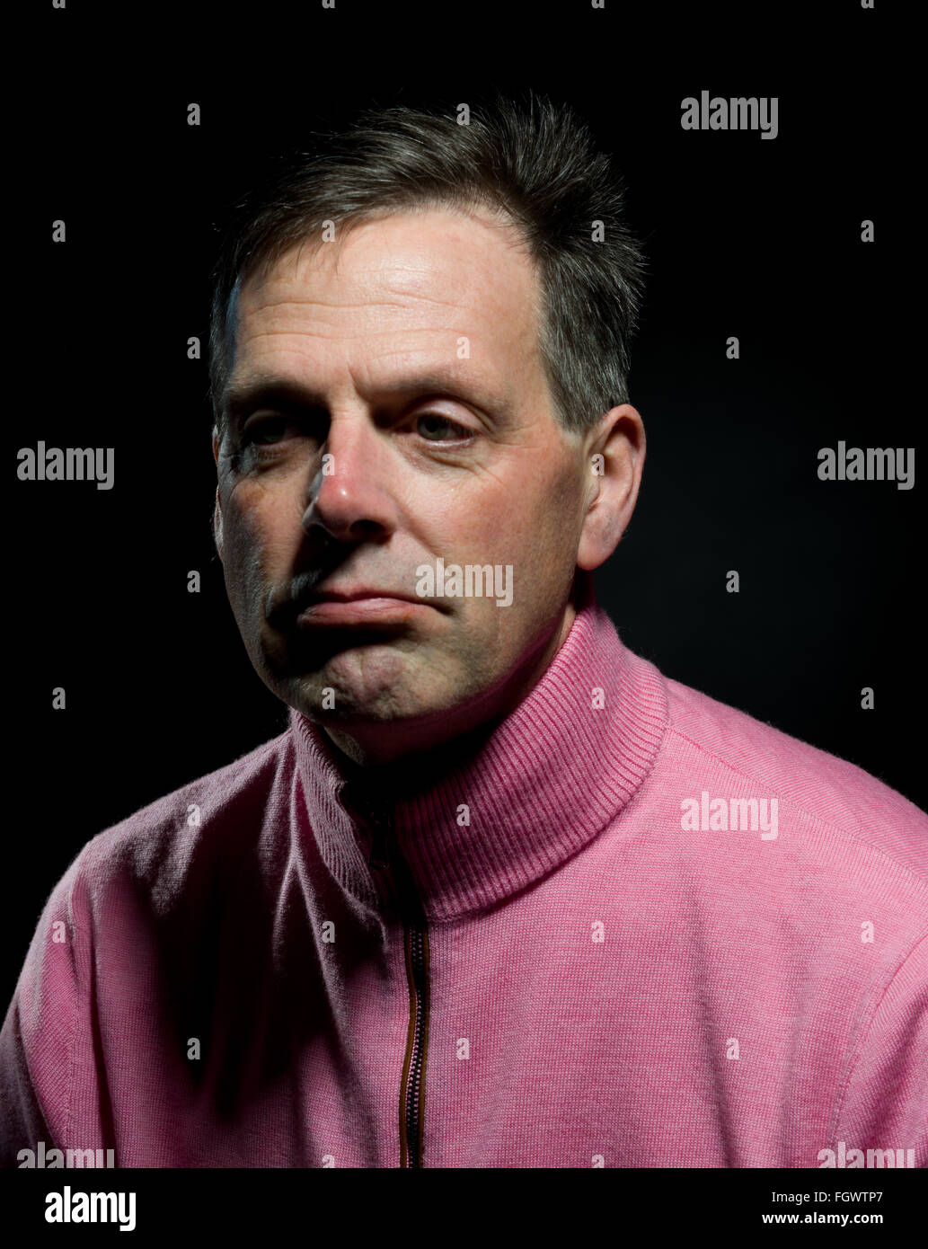 Middle aged man with a sad face. Fed up expression. Bored and lonely. Depression. Mental health issues. Stock Photo