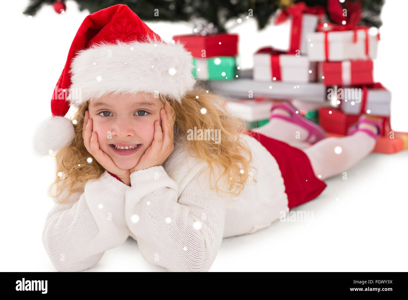 Composite image of festive little girl smiling at camera Stock Photo ...