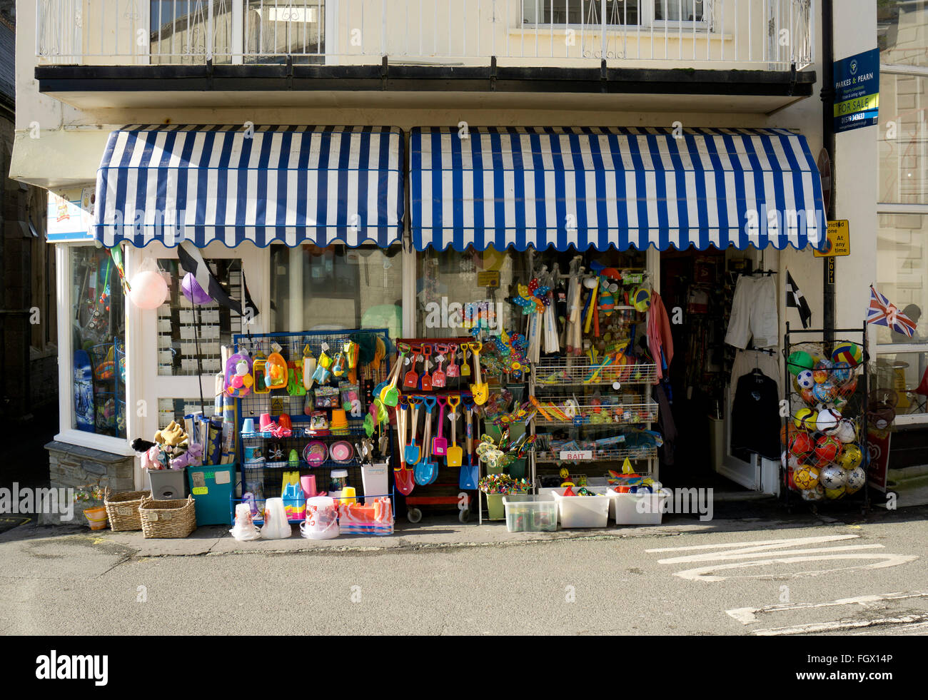 A traditional British seaside shop selling buckets and spades, beach