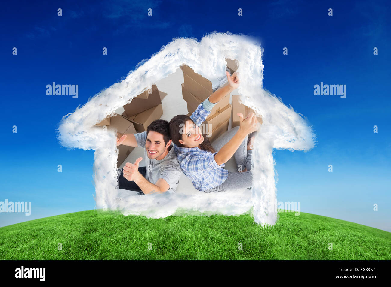 Composite image of overview of a happy couple giving thumbs up Stock Photo