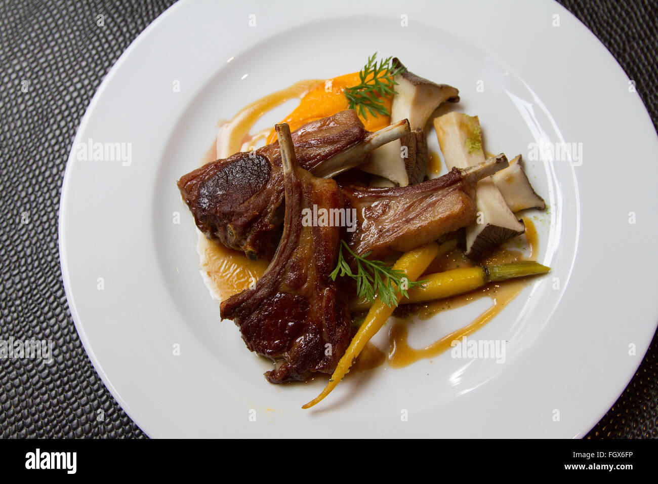 Veal chops with mushrooms and carrot Stock Photo