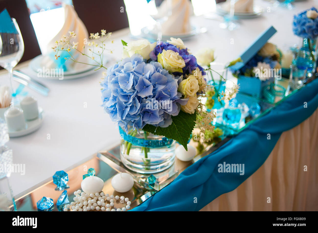 beautiful bouquets decoration on wedding table in a restaurant Stock Photo