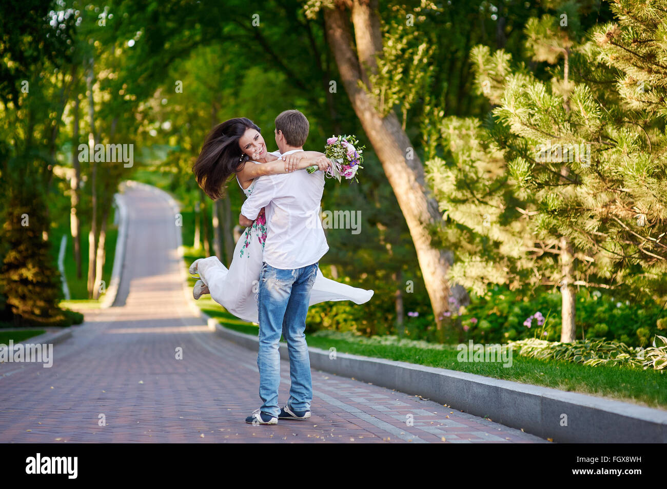 happy loving couple walking in the summer park Stock Photo - Alamy