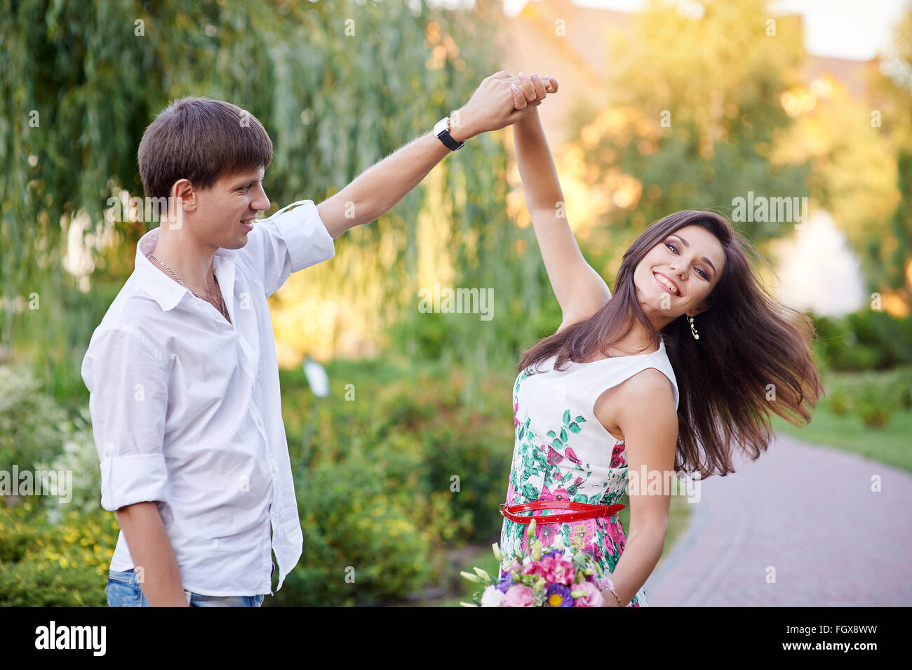 happy loving couple walking in the summer park Stock Photo - Alamy