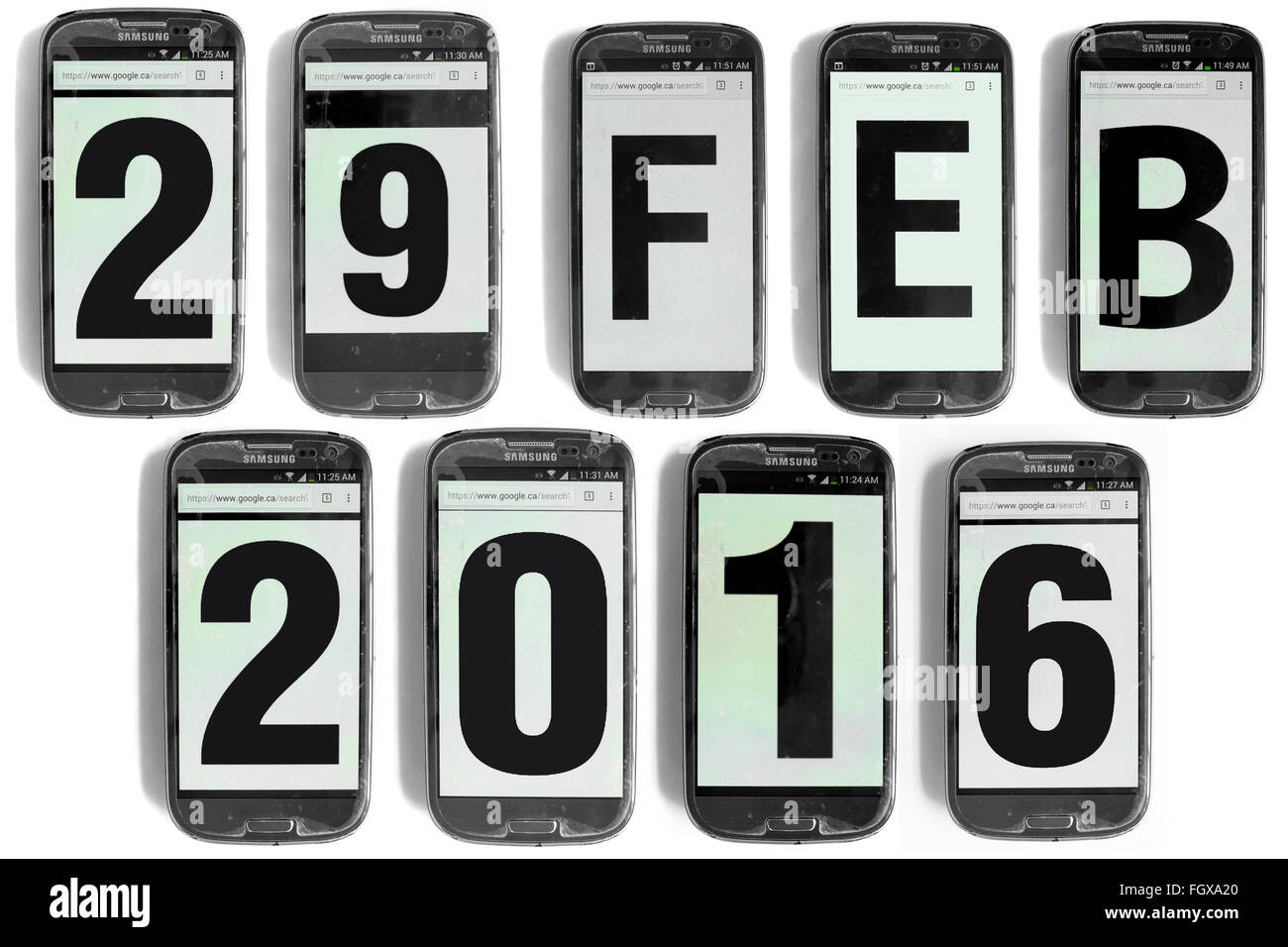29 Feb 2016 written on the screens of smartphones photographed against a white background. Stock Photo
