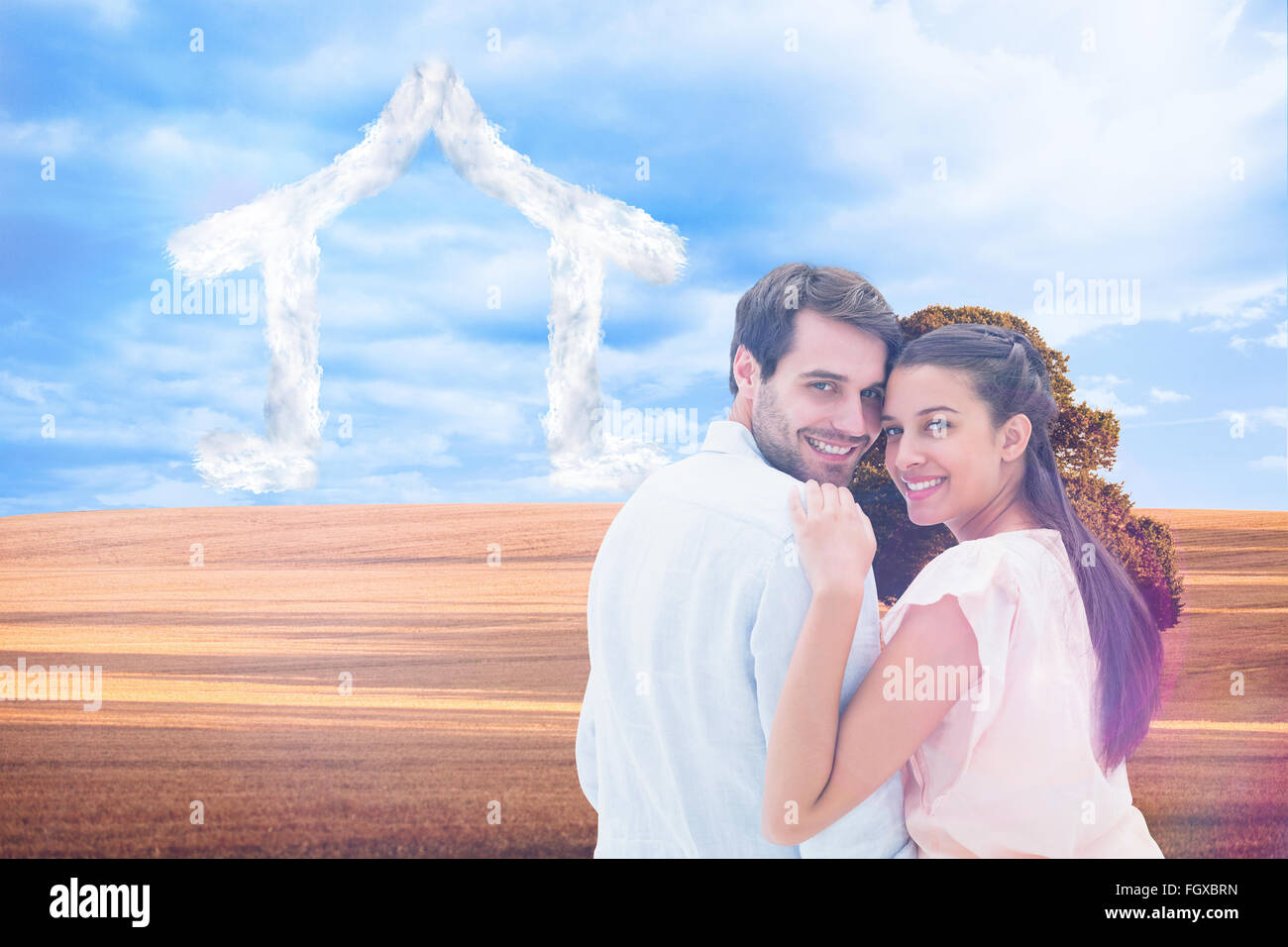Composite image of attractive young couple smiling at camera Stock ...