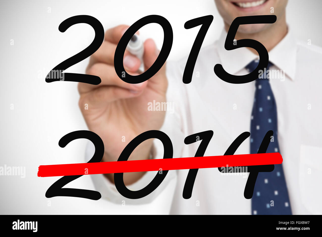 Composite image of businessman writing on camera with a black marker ...