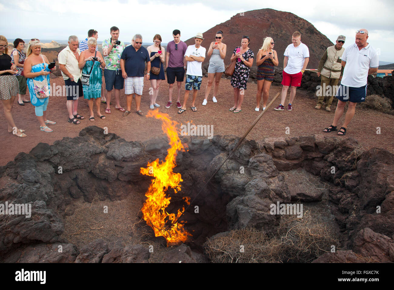 auto combustion experiment, tourists, Parque Nacional de Timanfaya, Lanzarote island, Canary archipelago, Spain, Europe Stock Photo