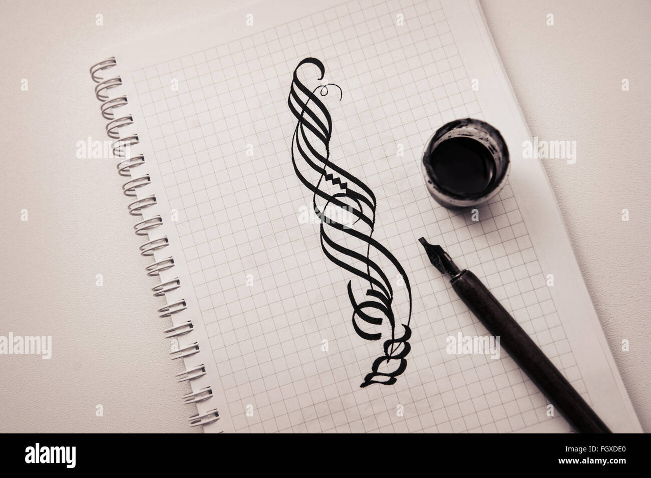 calligraphic draw with pen and ink on paper Stock Photo Alamy