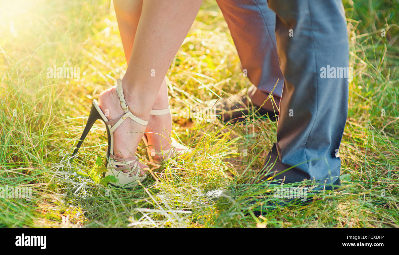 lower legs of woman and man standing opposite each other Stock Photo