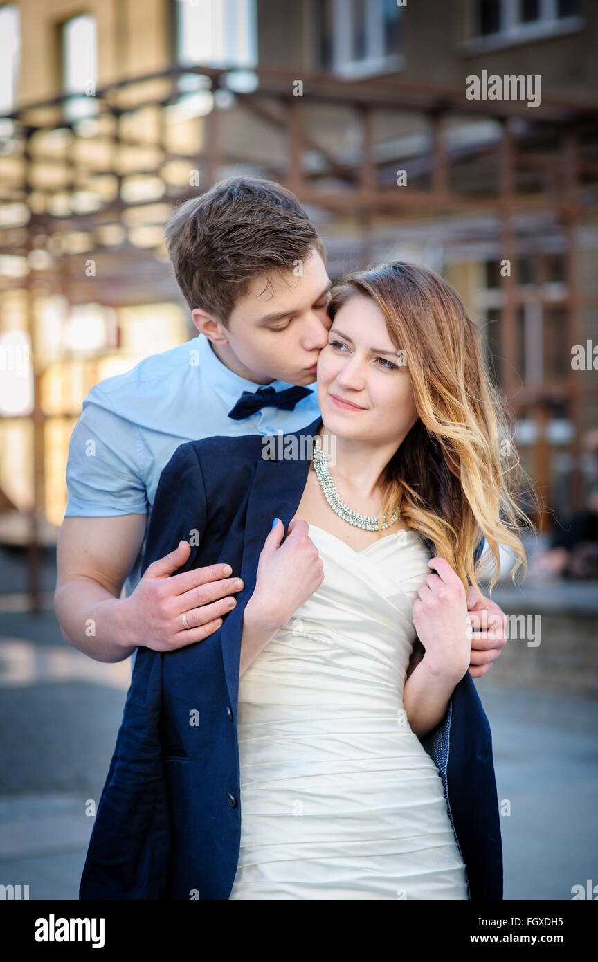 bride and groom are walking in city on wedding day Stock Photo - Alamy